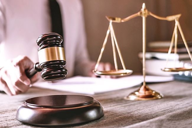 Woman loses bid to drop gun charge, trial set for Oct 6