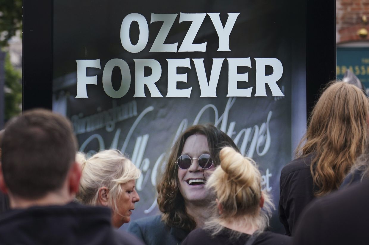 A sign honours musician Ozzy Osbourne as thousands of fans gathered to watch a funeral procession for Black Sabbath frontman Ozzy Osbourne following his death aged 76, in Birmingham, England, Wednesday, July 30, 2025. Photo: AP