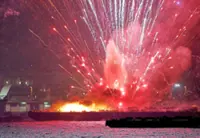 Sparks fly as festival barges catch fire