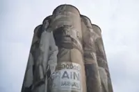 An Australian artist is painting huge murals on silos in the US Midwest