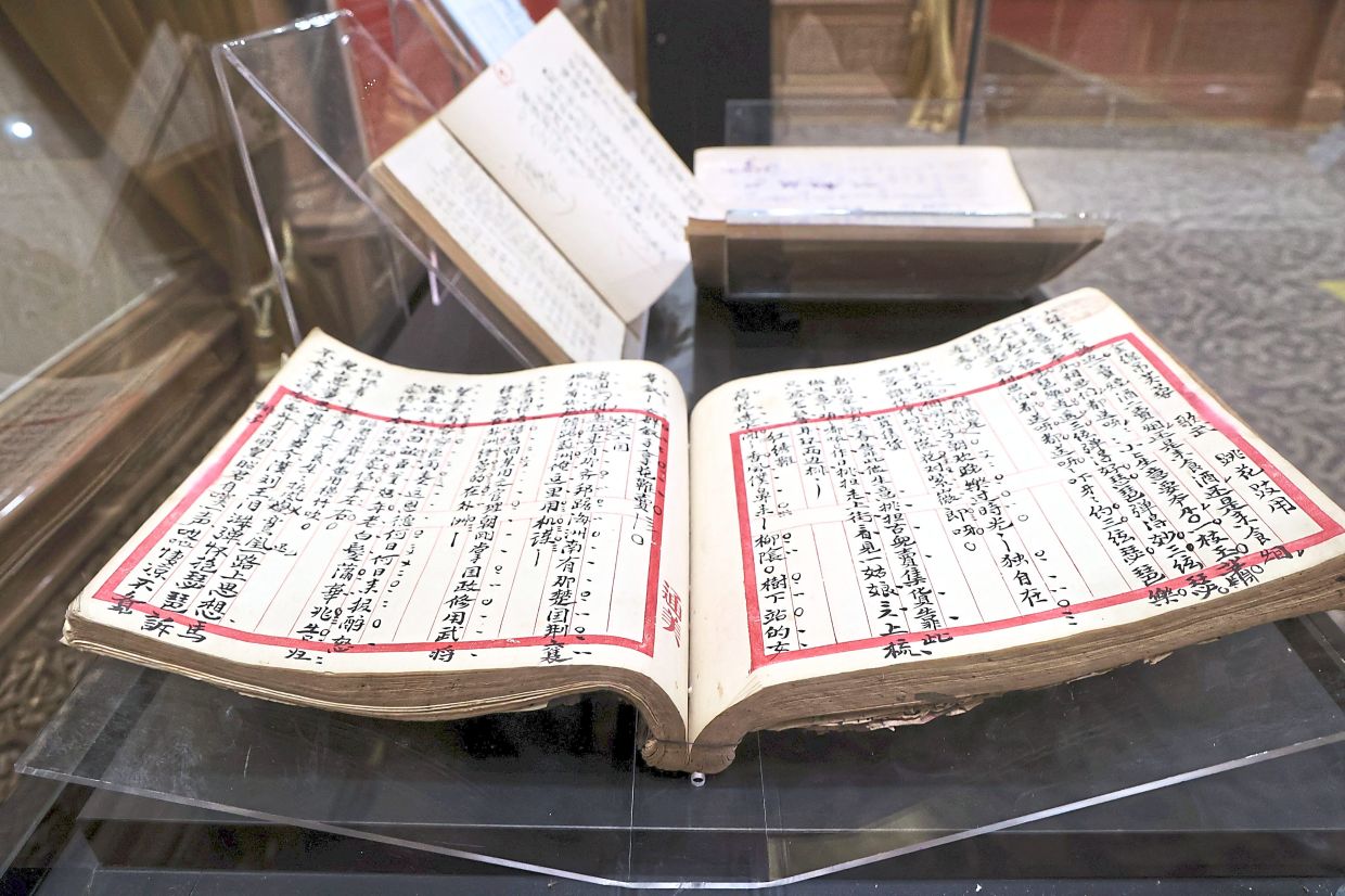 Apart from costumes and instruments, the exhibition also features handwritten Chinese opera scripts and literary works. Photo: The Star/Art Chen
