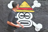 Indonesian artists and students wield 'One Piece' pirate flag as a protest symbol