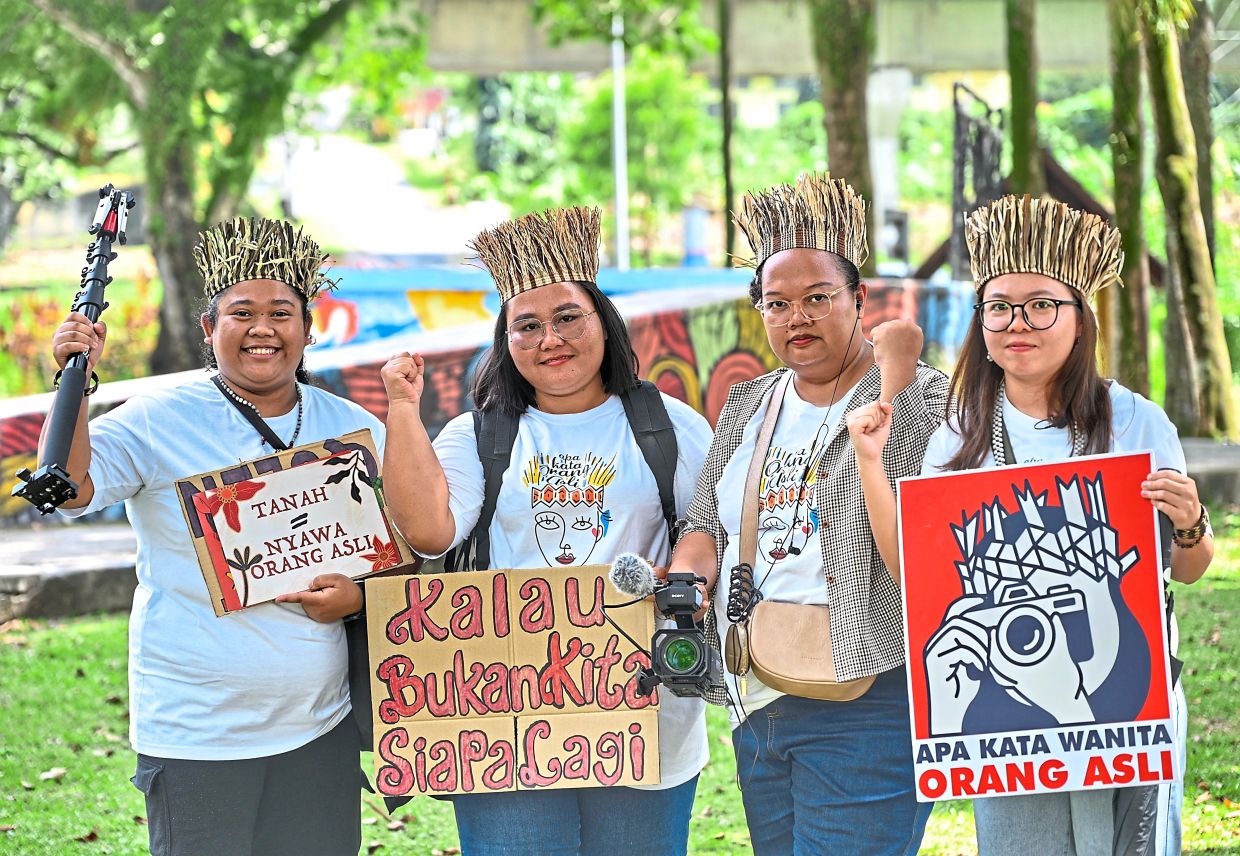 Making it theirs: The writer (far right) says Orang Asli are not just passive users of technology, but also partners in decision-making in technology development, especially AI. — RAJA FAISAL HISHAN/The Star 