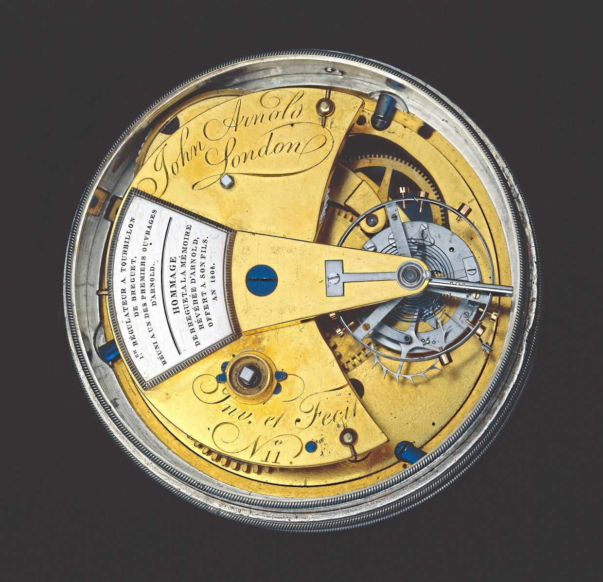 The back of the watch has an inscription in tribute to John Arnold.