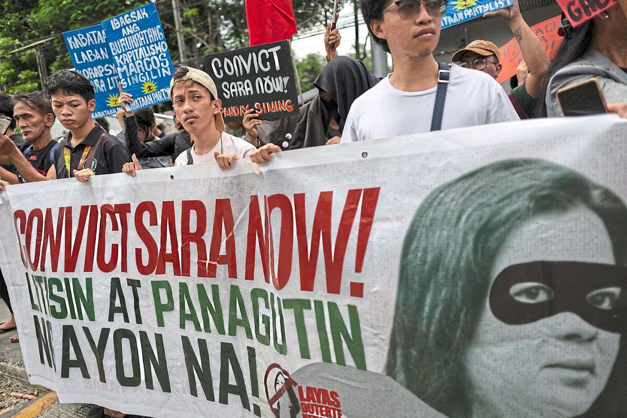 Boiling over: Filipinos stage a protest following the Senate's decision to archive the impeachment case against Duterte, in Quezon City, - REUTERS