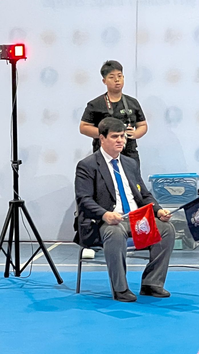 Lights to help deaf athletes be aware of cues from the referees are placed at the corners of the ring. — JAYSUMAN PUSPPANATHAN