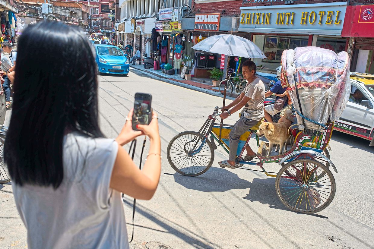 Tamang and Shyam are certainly popular with tourists, some of whom take pictures of the duo.