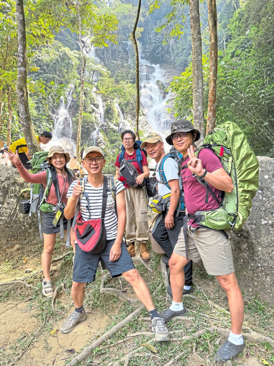 The happy five by Lata Penyel’s 60m waterfall and never-ending breezes.