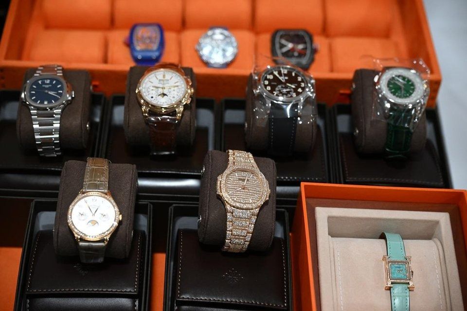 Luxury watches from Patek Philippe and Richard Mille are among the non-cash assets seized during investigations. - Photo: ST