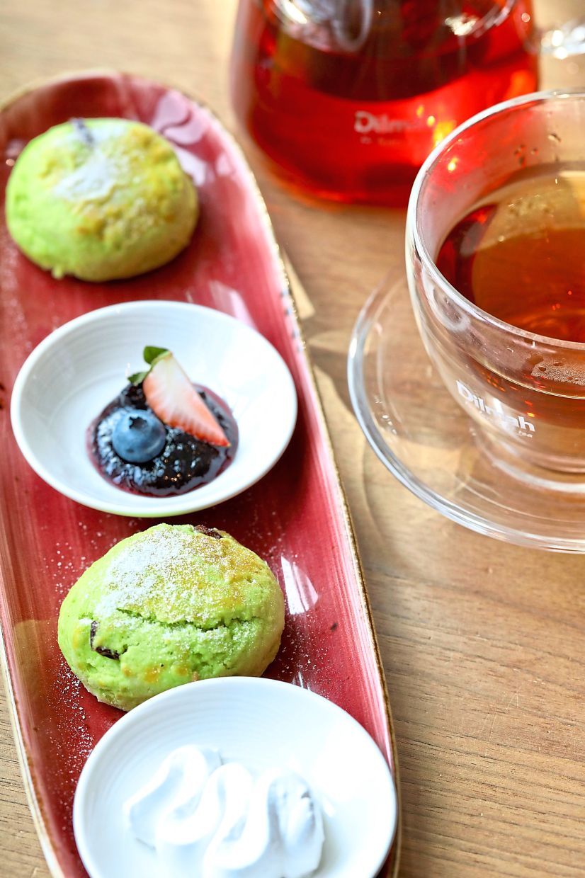 Pandan Cranberry Scone with clotted cream and jam.