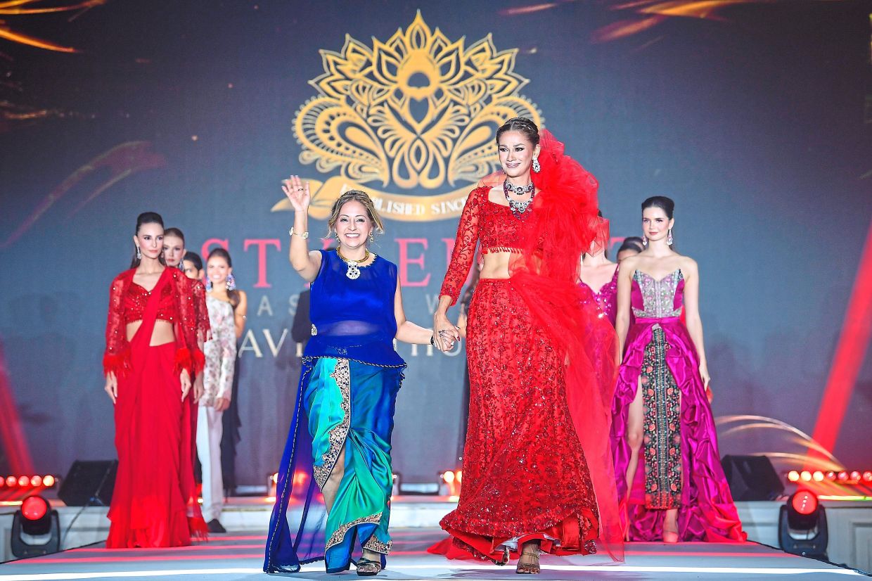 Miss Charm International 1990 Kavita Sidhu (front, right) and designer Kavita Thulasidas (front, left) during the fashion show.