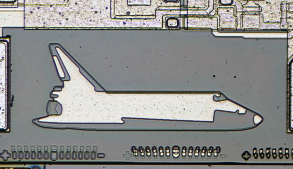 An undated photo provided by CPU Duke shows a space shuttle doodle. Decades ago, designers etched microscopic doodles onto silicon chips to leave their marks and now, techno-archaeologists search for the tiny fossils. — CPU Duke via The New York Times