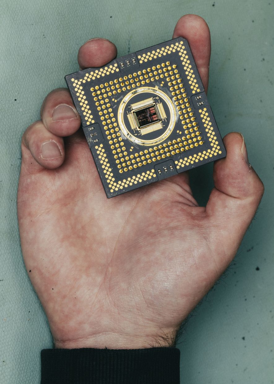 Kenton Smith finds 'Where's Waldo' doodles on a silicon wafers in Madison, Wisconsin, July 11, 2025. — Lyndon French/The New York Times