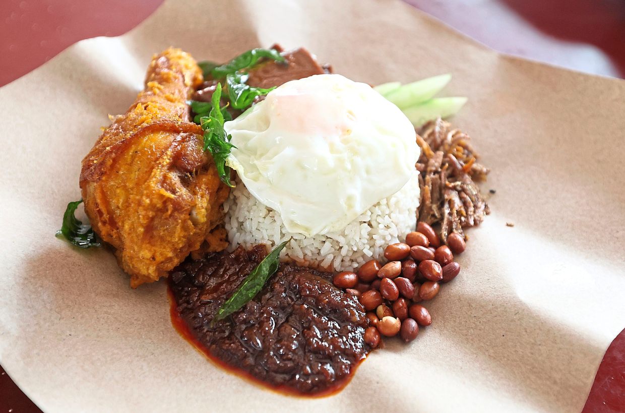 Nasi lemak with fried chicken and cuttlefish by Big Bro Nasi Lemak at Mayang Oasis Food Court in Petaling Jaya. 