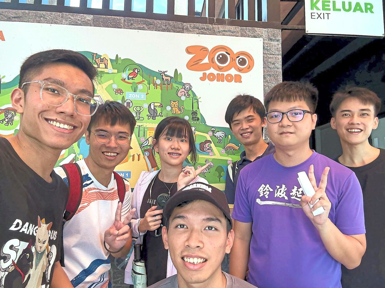 Gan (right) and his friends are eagerly awaiting the opening of the gardens.