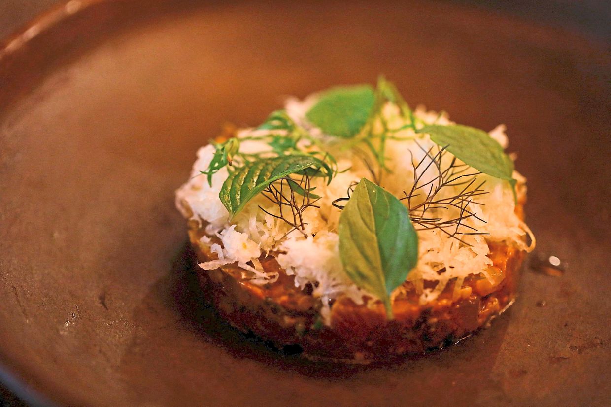 A crudo dish with leche de tigre (literally tiger's milk, but is actually a marinade made with lime juice, chilli, coriander and onion), and jicama served at Baldio.
