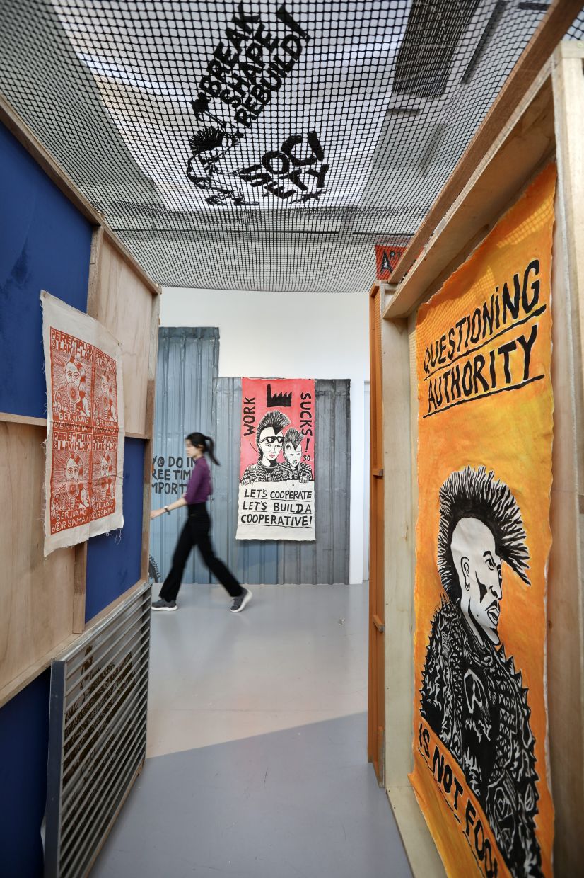 Tali Art Gallery's 'Society, WIP' is a duo exhibition featuring Balinese punk artist Gilang Propagila and KL-based printmaker Sanan Anuar. Photo: The Star/Low Lay Phon