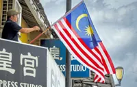 Sarawak business owner proudly flies national flag