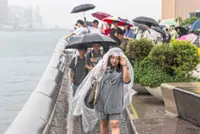 Tropical storm disrupts travel, courts and schools