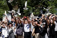 Japan minister joins crowds at controversial shrine to mark 80 years since world war defeat