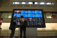 Japan's Nikkei ends at record high as yen weakens, economy shows resilience
