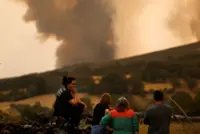 Spain battles 14 major fires with more expected