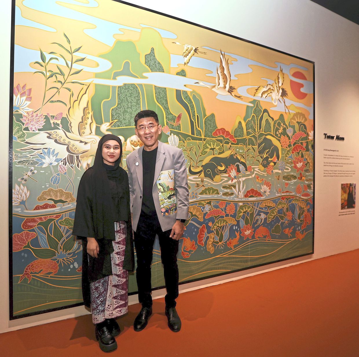Textile heritage: Farah and Ngei with her batik tile works at the launch of ‘The Transformative Power of Art’. — CHAN TAK KONG/The Star