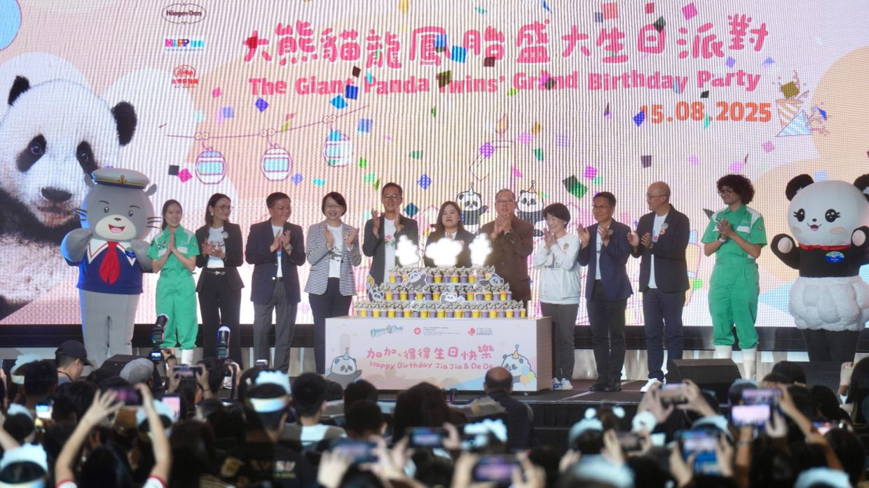 Participants pose for a group photo at the Giant Panda Twins' Grand Birthday Party at Ocean Park in Aberdeen on Aug 15, 2025. - Photo: China Daily