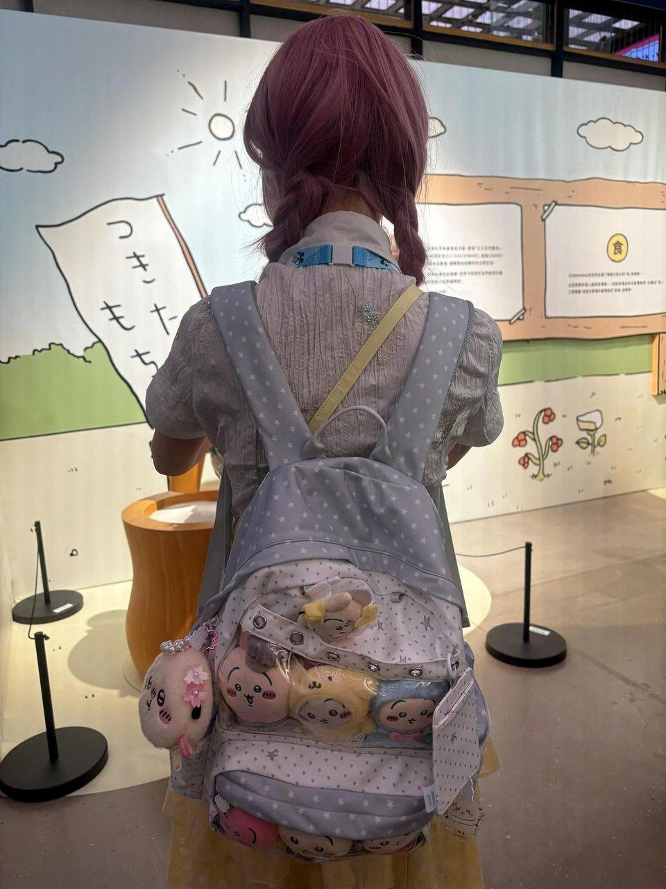 Fans at the Hong Kong exhibition carry bags with transparent pockets to show off their personal collection of Chiikawa plushies. - Photo: ST