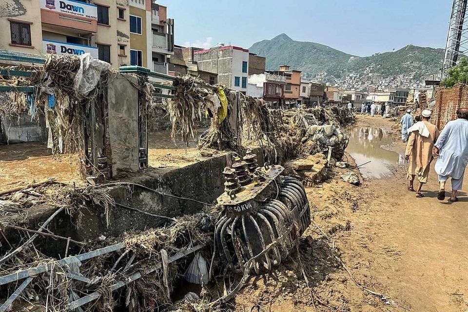 A damaged market after a flash flood in Mingora, Pakistan, on Aug 16. - Photo: AFP