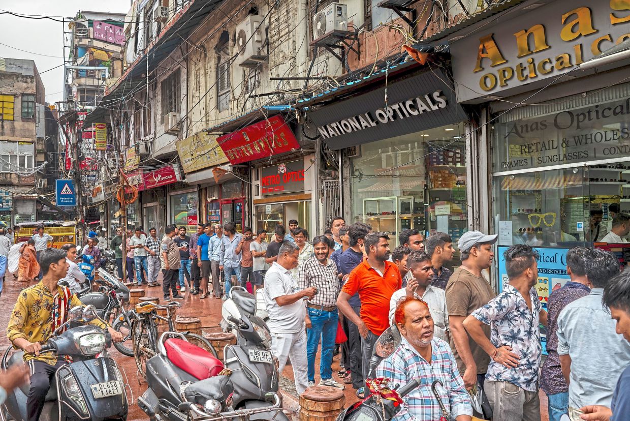 People lining up for their beloved snacks at a popular shop in New Delhi.