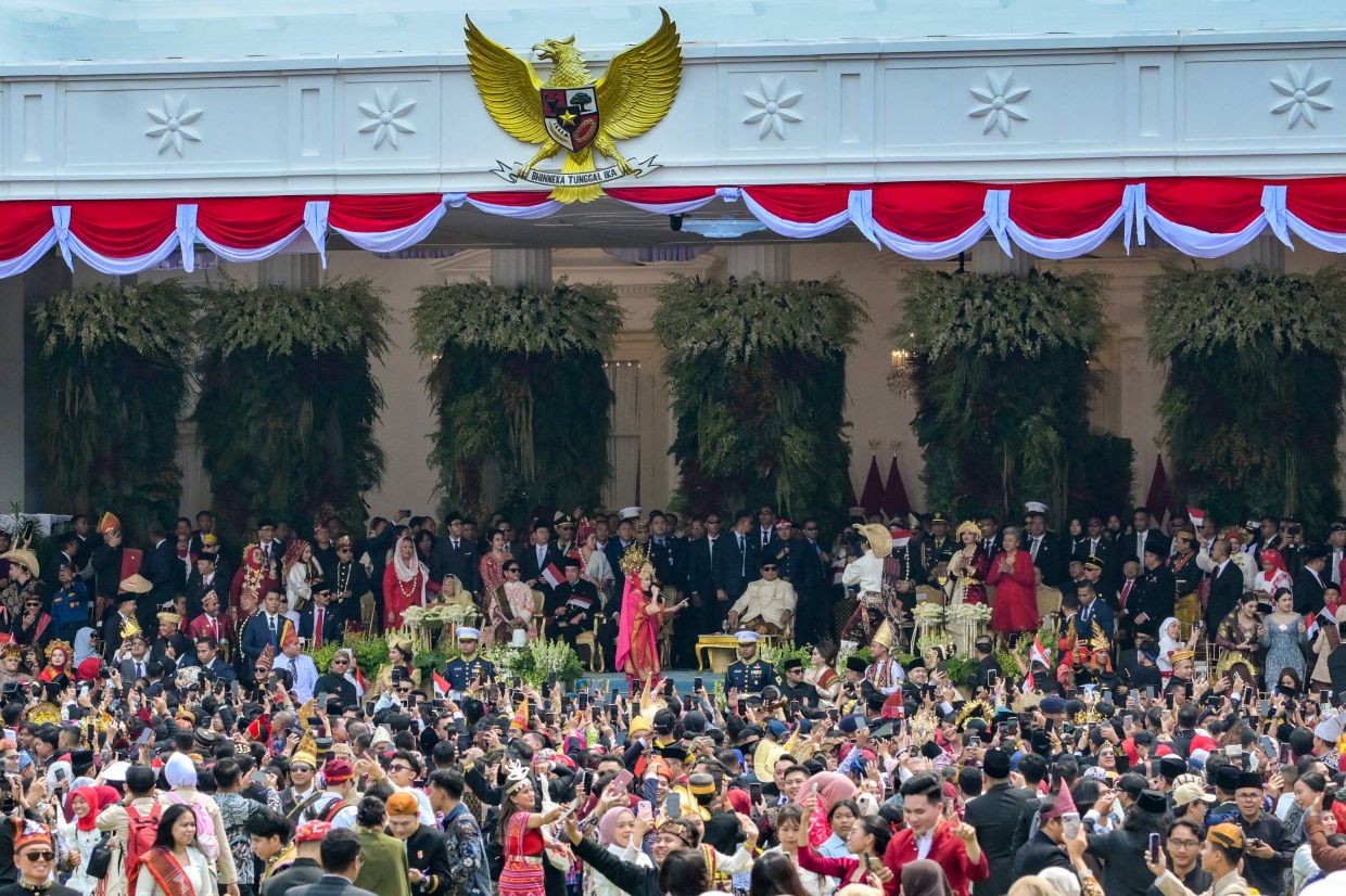 Indonesian President Prabowo Subianto (centre) watches as people dance during a flag raising ceremony marking Indonesia's 80th Independence Day at Merdeka Palace in Jakarta on August 17, 2025. - Photo: AFP