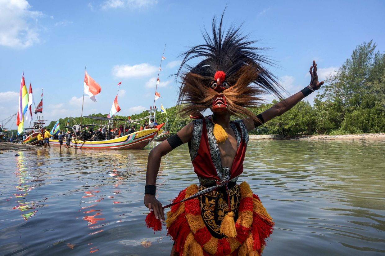 A man performs during celebrations to mark Indonesia's 80th Independence Day in Dasun, Central Java, on Sunday, August 17, 2025. -- Photo by AFP
