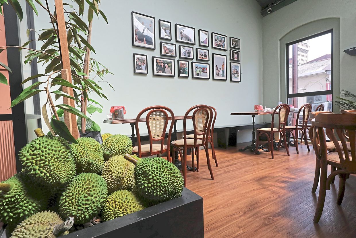 Unlike many other cheerless durian shops, Ang designed MyBolehBoleh to be a fun, attractive spot for locals and tourists. —SAMUEL ONG/The Star
