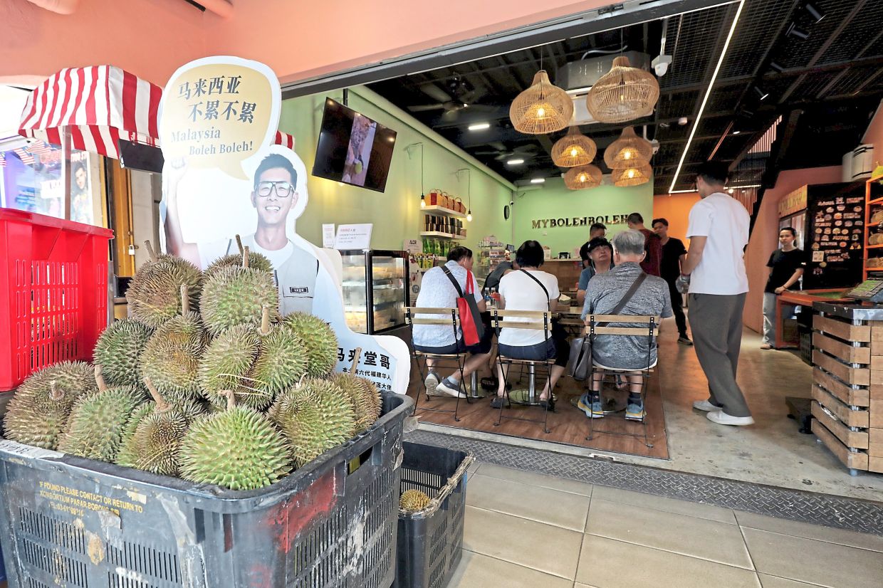 Ang's store mostly sells premium durian from single-origin old farms that Ang himself has visited or dealt with. — SAMUEL ONG/The Star