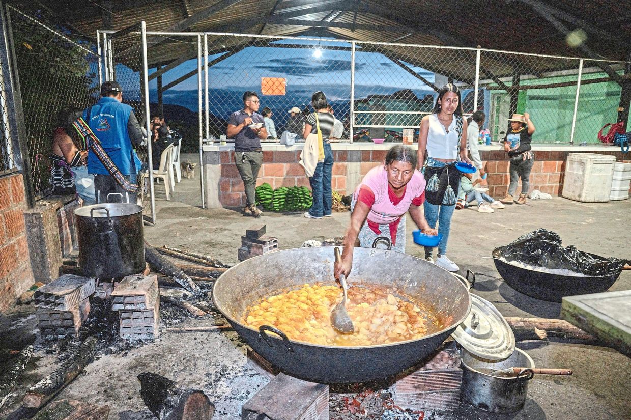 Those who take part in the Indigenous youth assembly come to get food in the conflict-hit reserve of Las Delicias, Cauca, Colombia.
