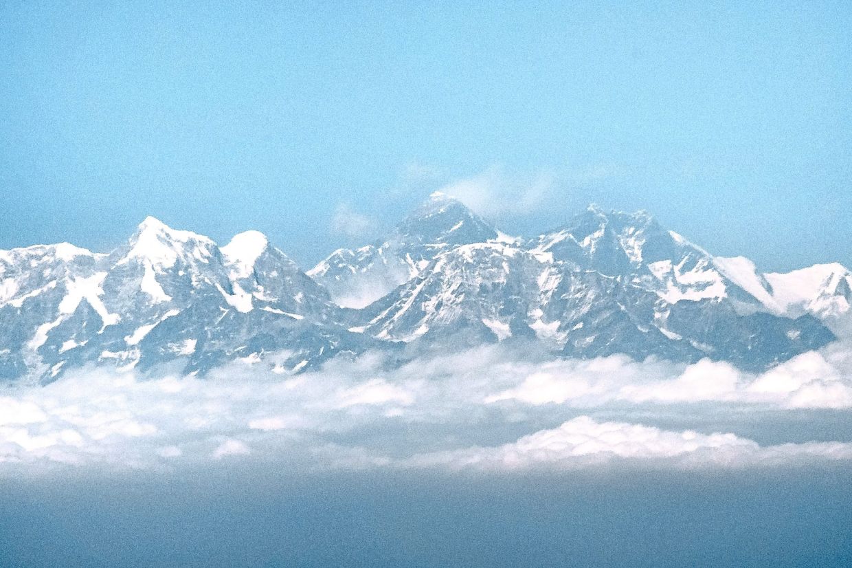 Drones are changing mountain climbing, helping carry some of the heavy equipment up Mount Everest. — SINA SCHULDT/dpa