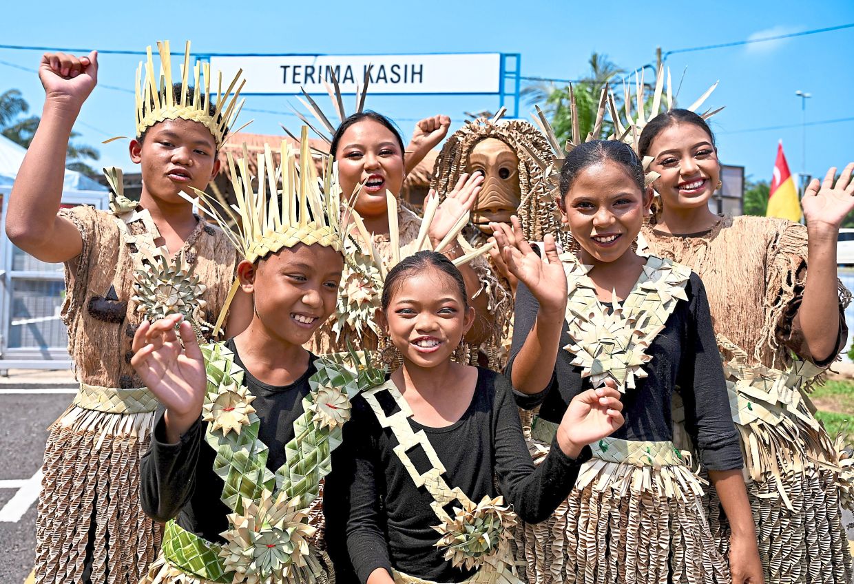 Youths of the Mah Meri tribe, known for their elaborate wood carvings and dance, in their traditional attire. — Photos: RAJA FAISAL HISHAN/The Star