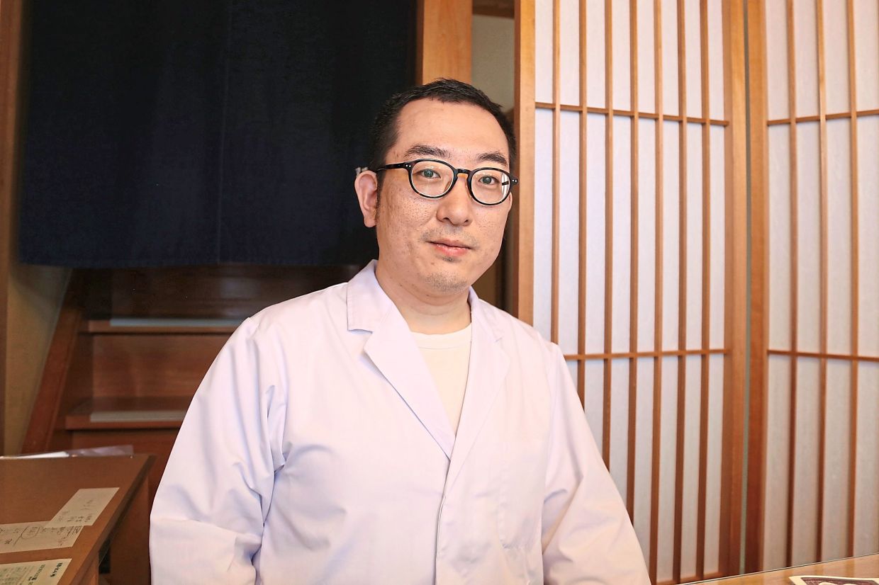 Yoshihiro Kobayashi, owner of Tsukushin, which offers traditional Japanese preserved food called tsukudani.