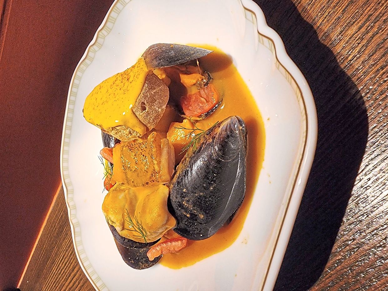 The hearty, rustic seafood stew is a celebration of the bounty of the sea.
