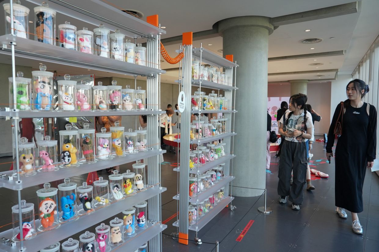 People visit the exhibition 'Era of Uglies Has Arrived' by Alibaba's Taobao, in Hangzhou, Zhejiang province, China August 13, 2025. REUTERS/Nicoco Chan