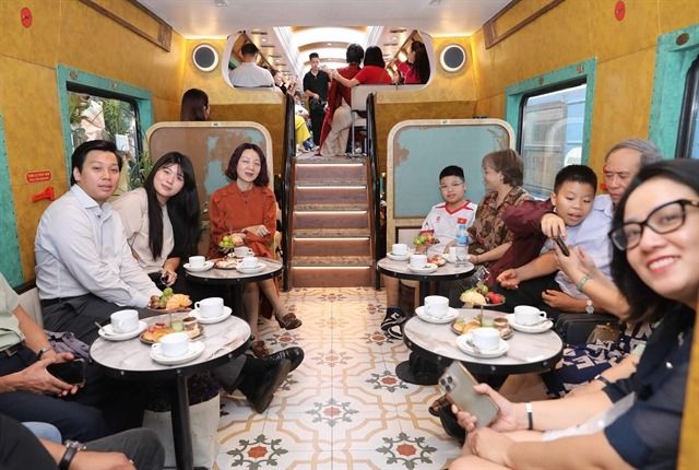 The Hanoi Train features five double-decker seating carriages and two others designed for check-in experiences. - Photo: VNA/VNS