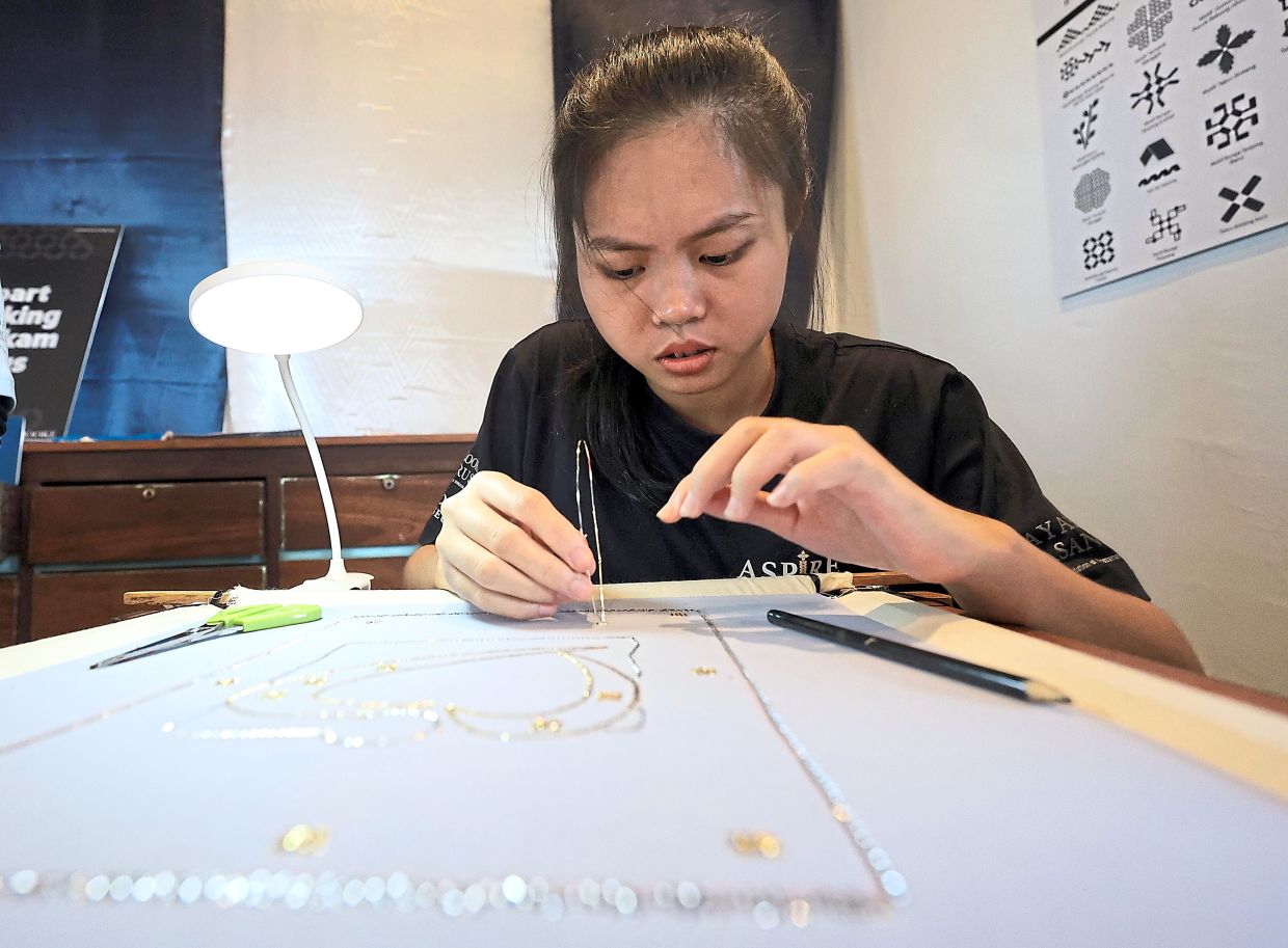 Vivi hopes to continue making keringkam after learning the craft under the Aspire programme.