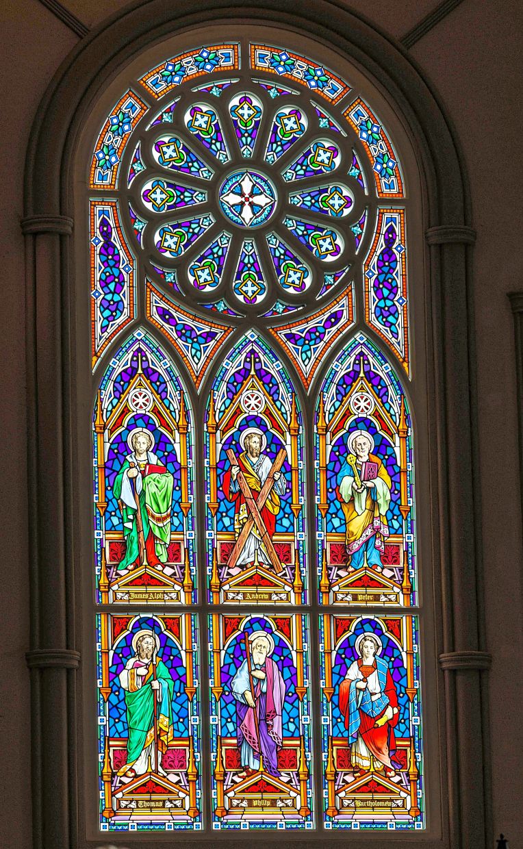 A stained glass panel depicting figures from the Bible.