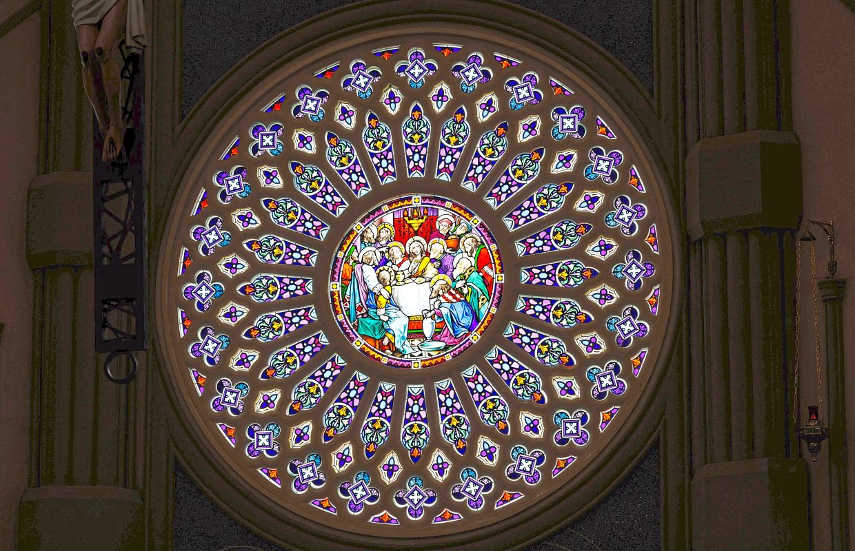 The rose window featuring The Last Supper at its centre.