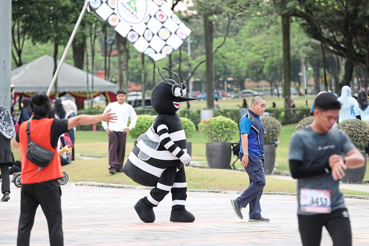 A person dressed as a mosquito spotted among the attendees.