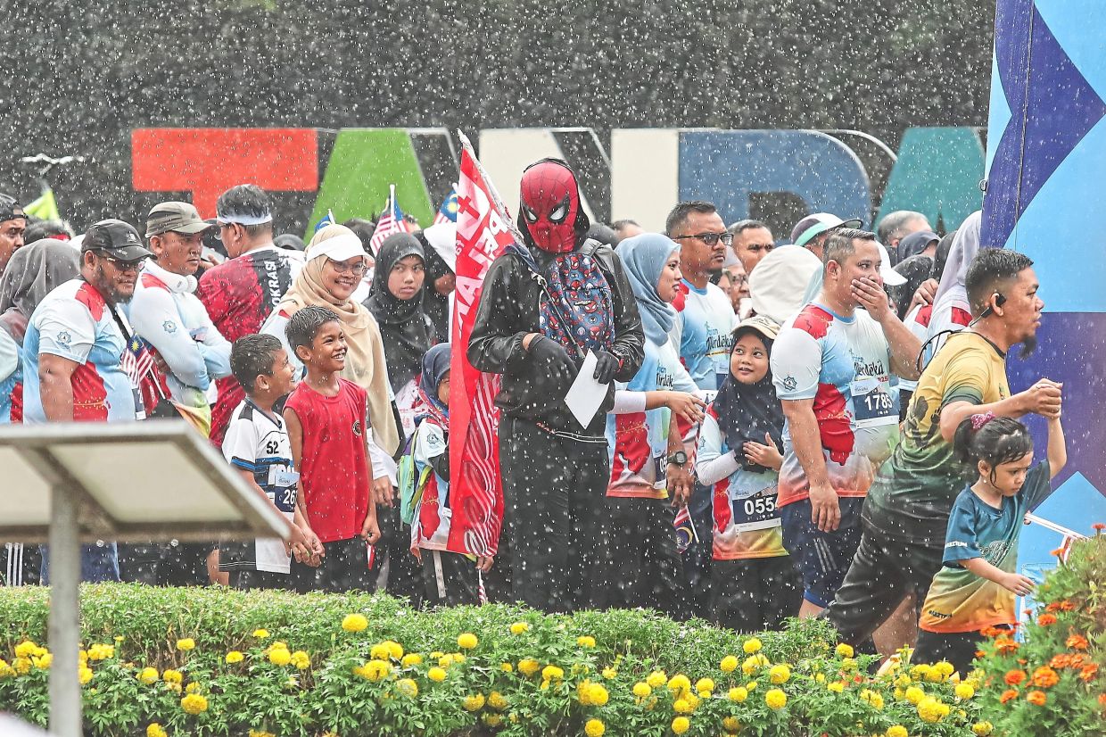 Even the rain could not keep ‘Spider-Man’ away from the fun.