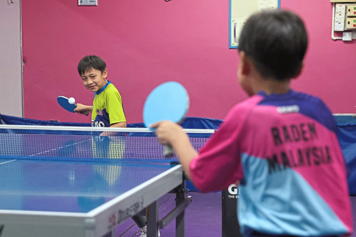 Habib Adrian (left) training with Raden Zharif at a ping-pong centre in Petaling Jaya. 