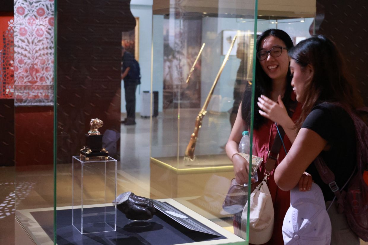 Tipu Sultan’s magnificent throne was dismantled for its gold and jewels. The exhibition at the Islamic Arts Museum Malaysia features one of the few gem-studded finials that survived the looting - even the throne’s wooden tiger-paw feet were taken by the British. Photo: The Star/Kamarul Ariffin