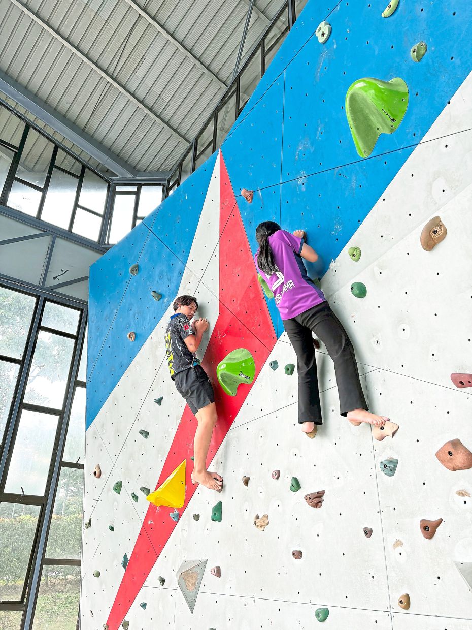 Youths using the rock climbing facility at the Rock Yard of Johor Baru TMIYC.